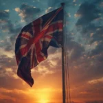Upside down national flag flying on a flagpole at sunset, symbolizing distress, protest, or emergency and explaining what an upside down flag means.
