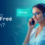 Customer service representative wearing a headset answering a call, visually explaining what does toll free mean with a toll-free phone number displayed on screen.