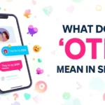 Illustration of a smartphone chat with heart emojis and messages saying “They’re my OTP!” next to the headline “What Does ‘OTP’ Mean in Slang?”, representing the slang meaning of OTP as “One True Pairing” used for favorite couples online.