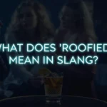 Unattended drink on a table at a dimly lit party with blurred people in the background and glowing text reading “What Does ‘Roofied’ Mean in Slang?” creating a serious awareness-focused atmosphere.