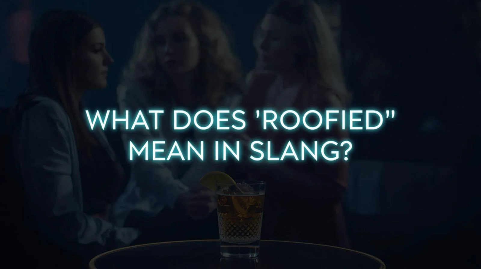 Unattended drink on a table at a dimly lit party with blurred people in the background and glowing text reading “What Does ‘Roofied’ Mean in Slang?” creating a serious awareness-focused atmosphere.