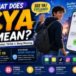Featured image for "CYA Meaning: What Does CYA Mean in Text, Snapchat, TikTok & Slang?" showing a young man waving goodbye while holding a smartphone, alongside a large chat screen displaying the message "CYA." The image explains that CYA commonly means "See Ya" in texting and can also mean "Cover Your Ass" in workplace slang. Colorful social media and messaging icons represent platforms like Snapchat, TikTok, Instagram, WhatsApp, Discord, and texting apps, highlighting the abbreviation's use in digital communication and internet slang culture.